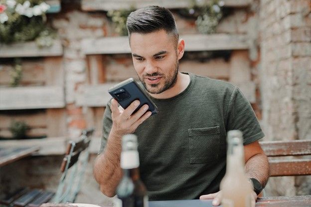 Making-Your-VoIP-Network-Bulletproof-Featured-Image.jpg man in gray crew neck long sleeve shirt holding black smartphone